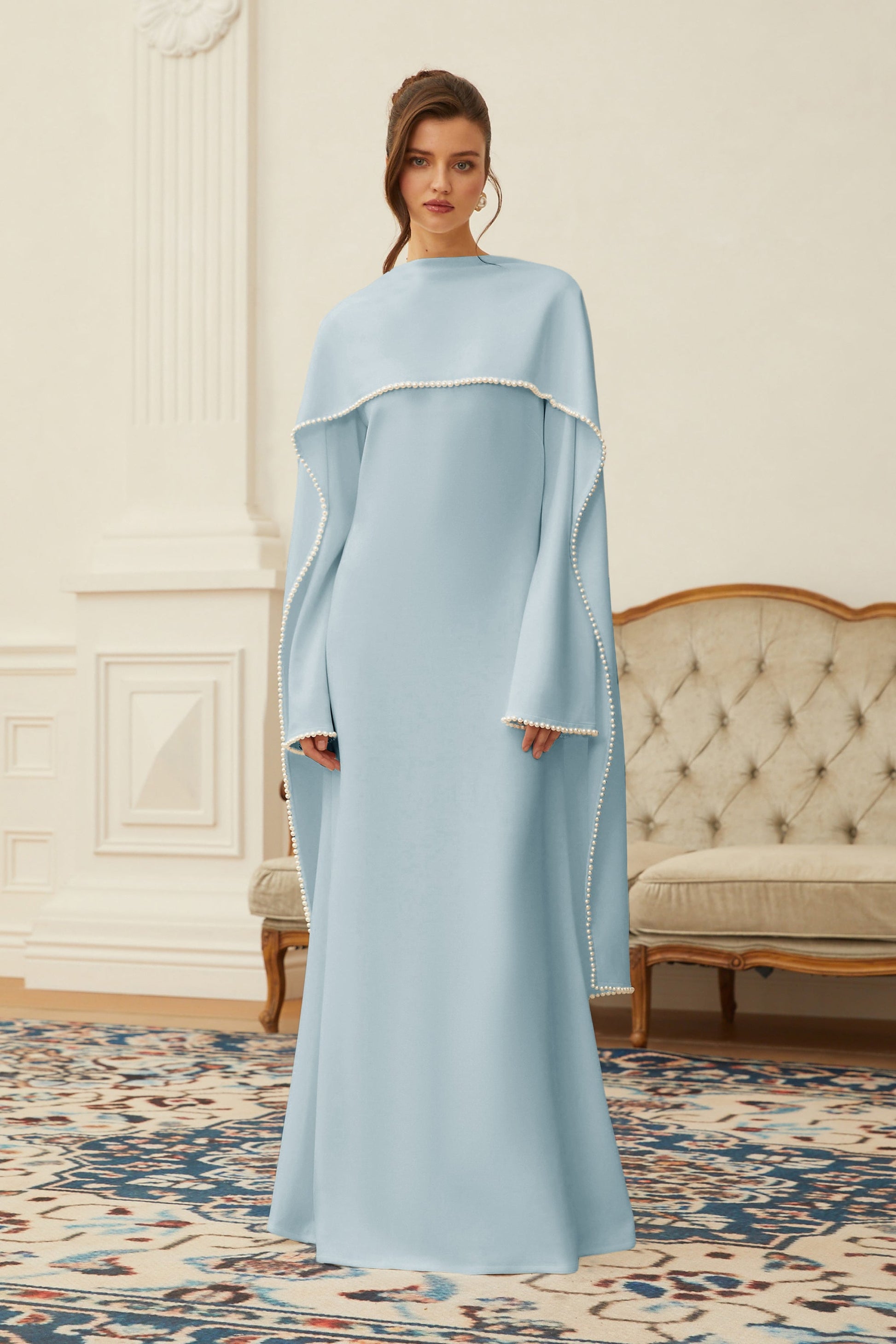 Montaracrest Piroska Blue Pearl Trim Shawl Maxi Dress featuring elegant fabric, intricate pearl trim, and flowing silhouette.