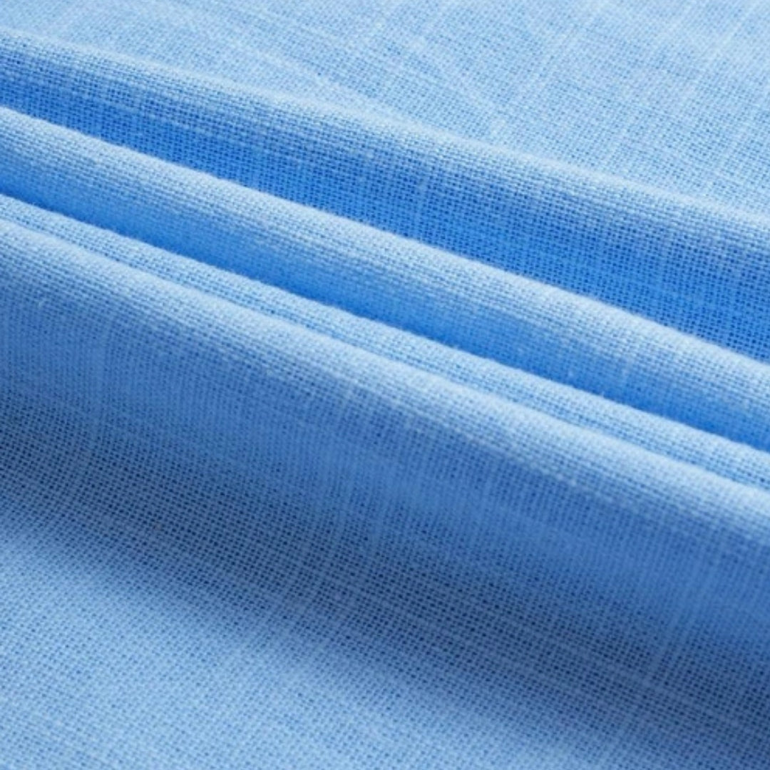Light blue DELACROIX casual shirt by Montaracrest with button-down front and collar, displayed on a hanger.