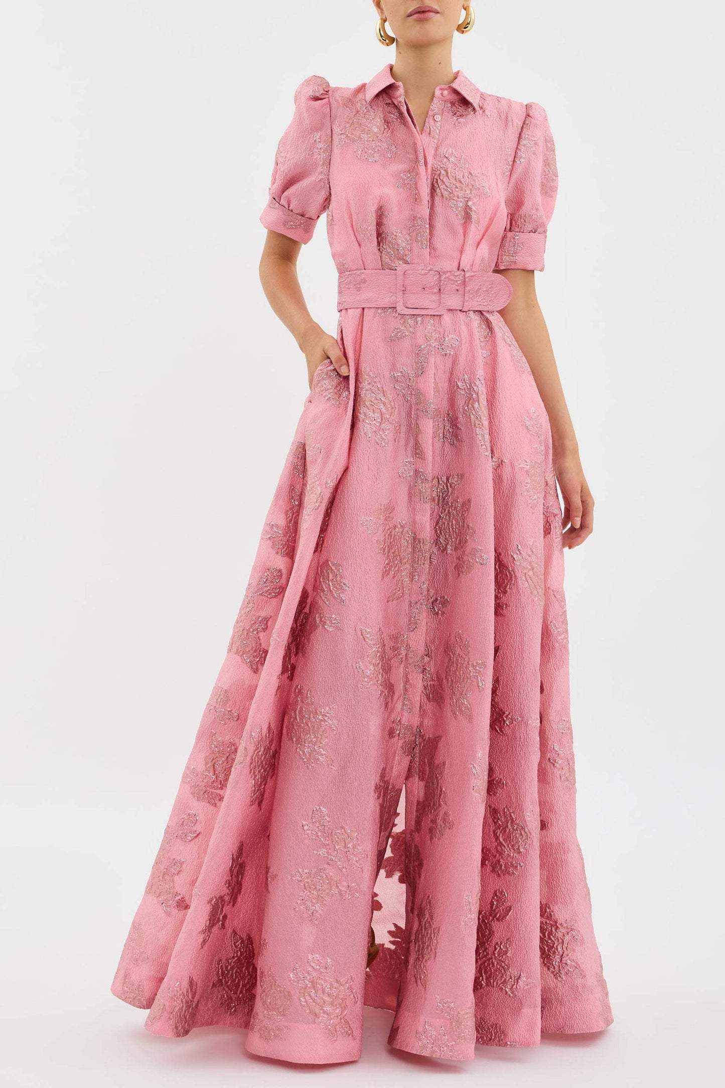 Elegant long dress with waist belt by Montaracrest, featuring flowing fabric and sophisticated design for timeless style.
