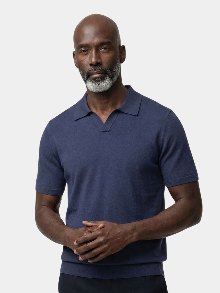 Montaracrest Navy Navy Class Polo with a white collar and logo, a classic men's polo shirt displayed on a hanger.