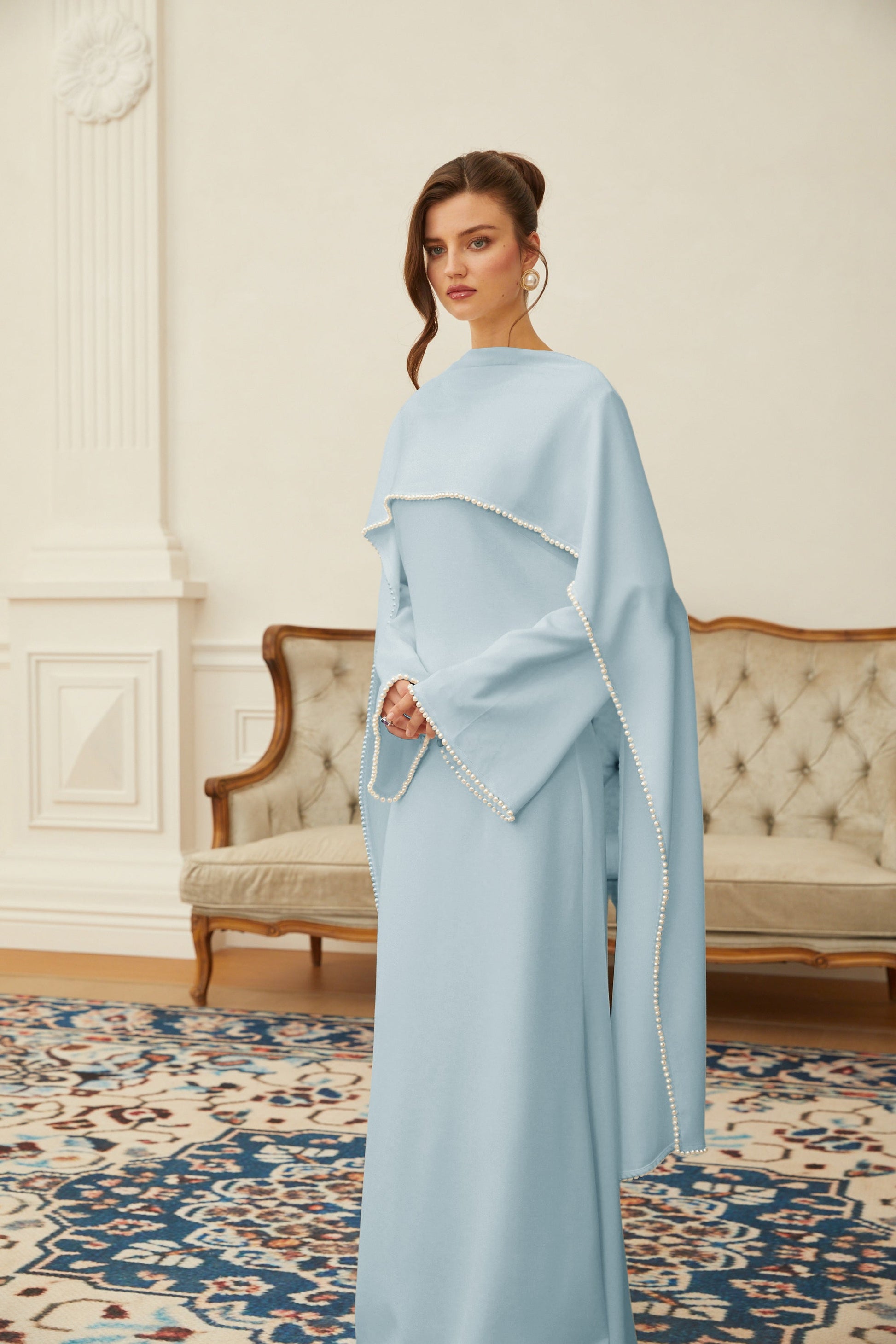Montaracrest Piroska Blue Pearl Trim Maxi Dress featuring a flowing silhouette and elegant shawl detail.