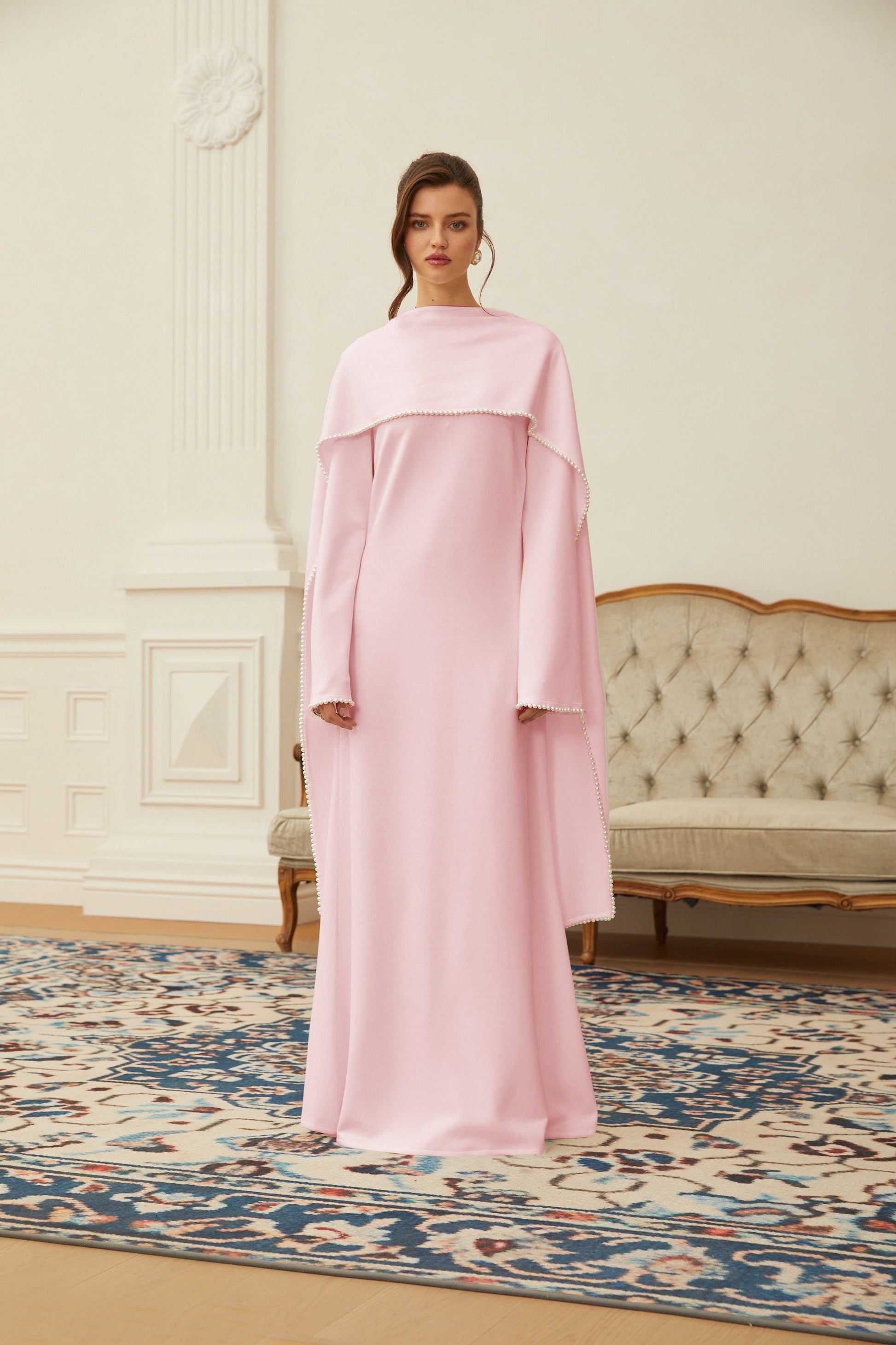 Montaracrest Piroska Pink Pearl Trim Maxi Dress with shawl detail, featuring elegant pink fabric and decorative pearl accents.