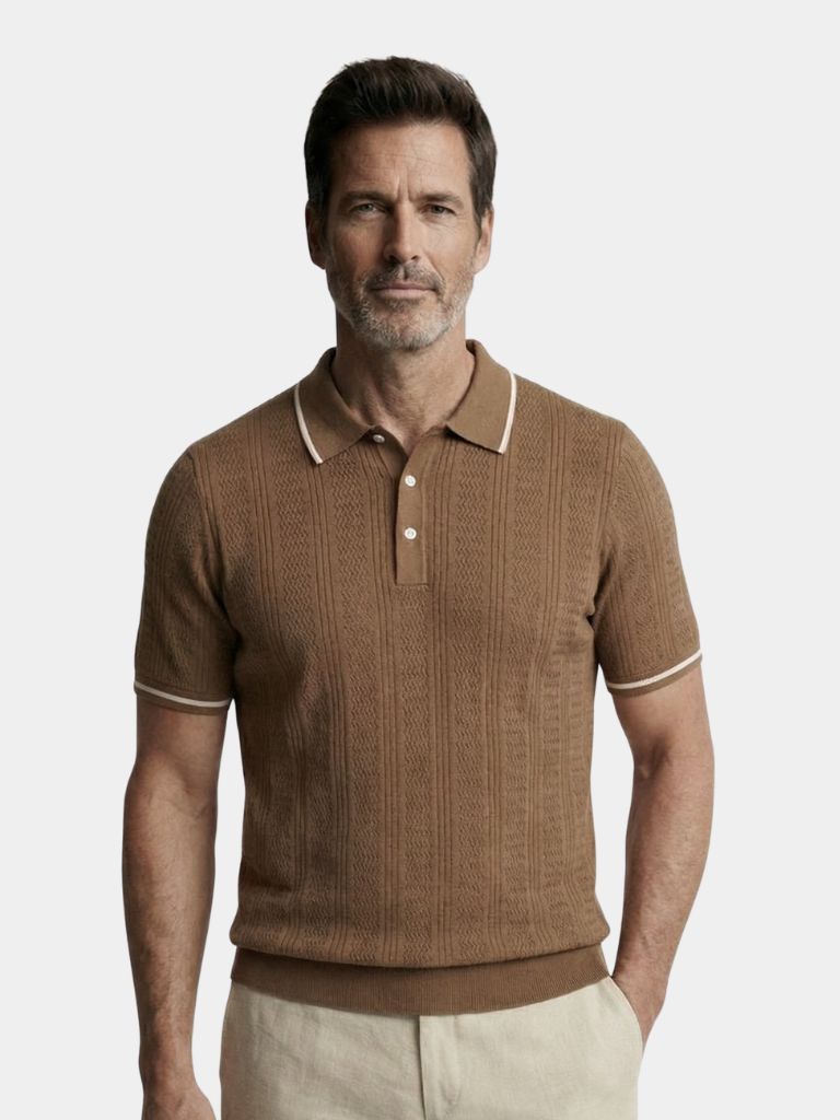 Montaracrest Café Milano polo shirt in navy with a classic collar and short sleeves, displayed on a hanger.