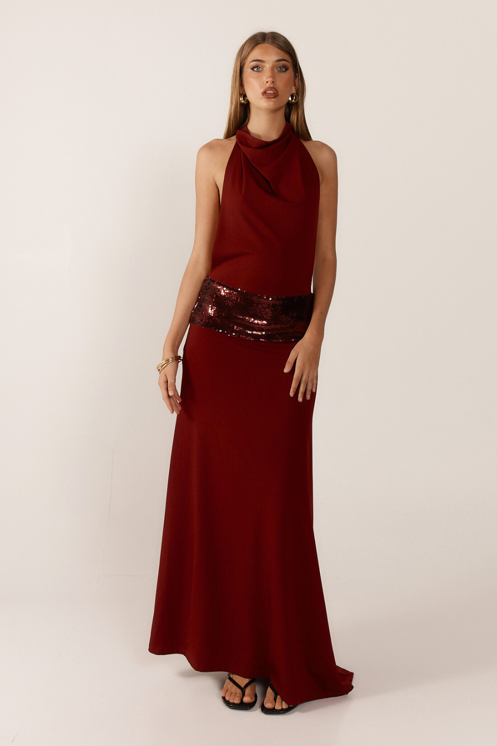 Montaracrest Jade sequin gown with elegant design, featuring shimmering green sequins and flowing fabric for formal occasions.