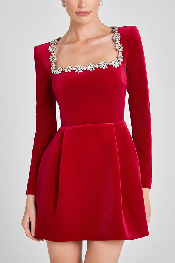 Montaracrest Mini A-Line Dress with jewelry detailing, showcasing elegant fabric and intricate embellishments.