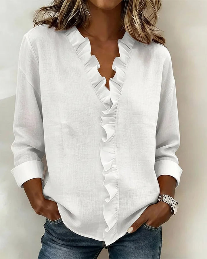 Montaracrest Chiara V-neck blouse with delicate ruffle trim, lightweight fabric, and elegant design perfect for casual or semi-formal wear.