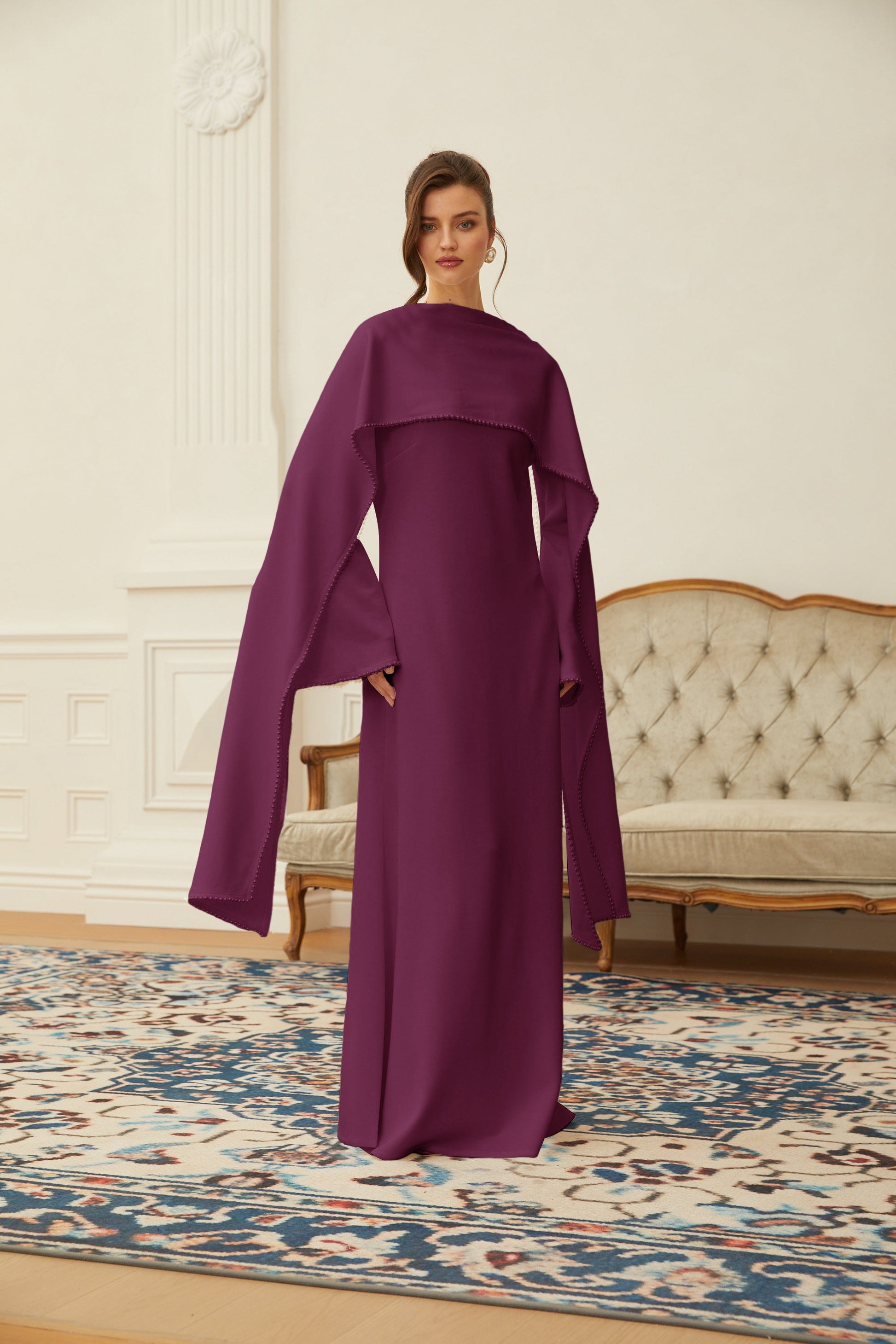 Montaracrest Piroska purple maxi dress featuring pearl trim shawl detail and elegant flowing fabric.