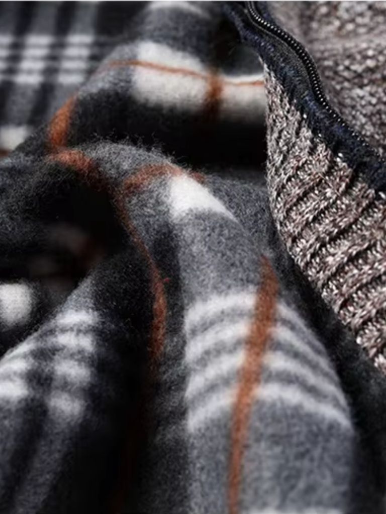 Montaracrest knitted jacket with a textured pattern, long sleeves, and a cozy fit, displayed on a hanger.