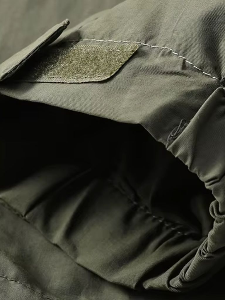 Montaracrest waterproof tactical jacket for expeditions, shown in dark color with multiple pockets and durable fabric.