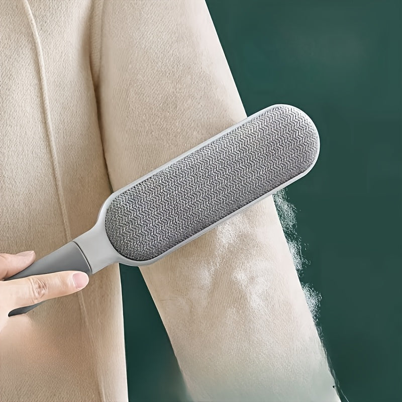 Montaracrest fabric and lint brush with handle, designed for removing dust and pet hair from clothing and upholstery.