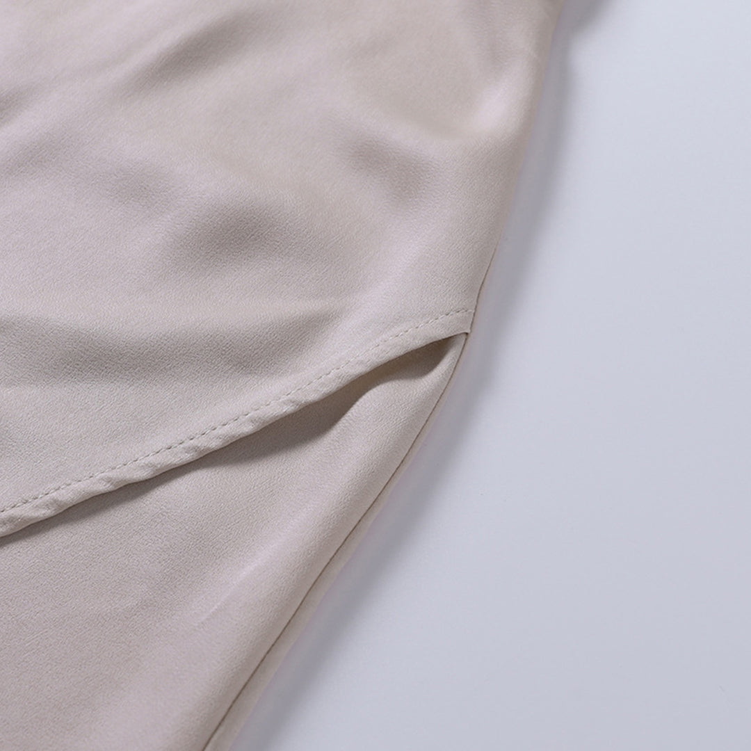 Elegant long slip dress with side slit by Montaracrest, flowing fabric and stylish design, perfect for evening wear.