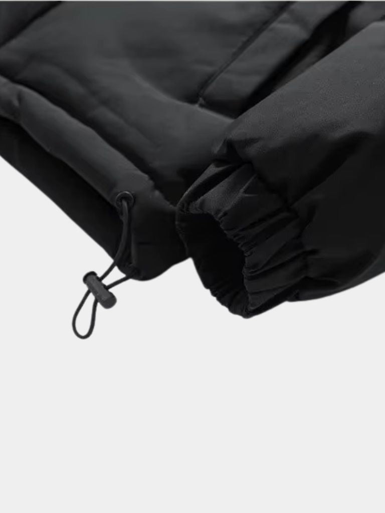 Montaracrest Giacca Puffer Summit jacket in black with quilted design and hood, suitable for cold weather outdoor wear.