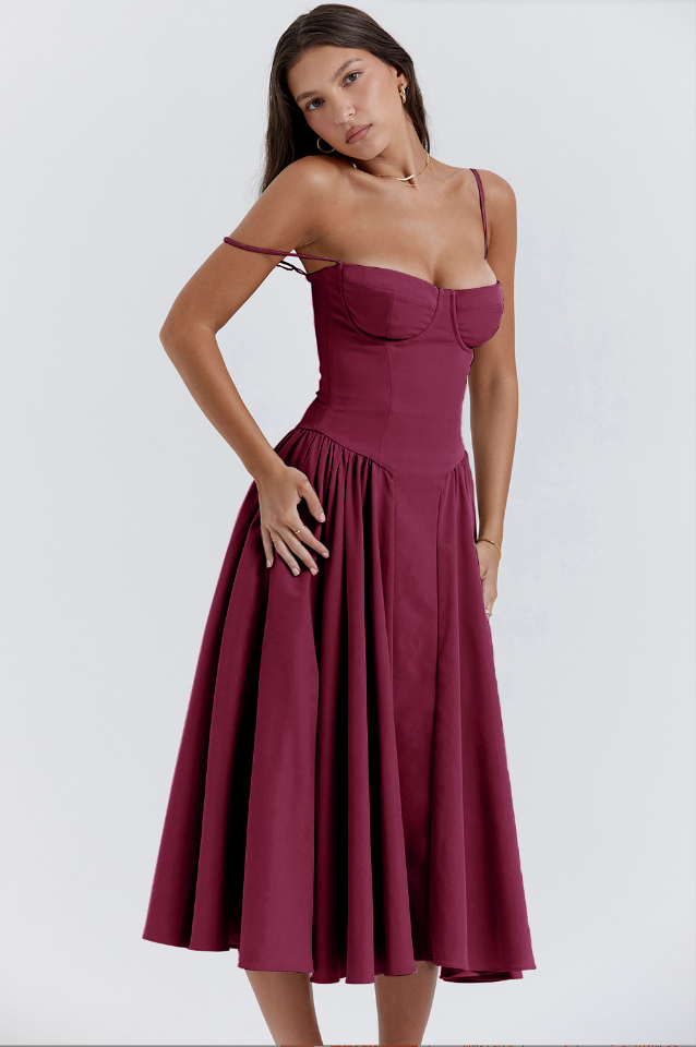 Elegant midi pleated dress by Montaracrest featuring a structured bodice and side pockets, perfect for stylish occasions.