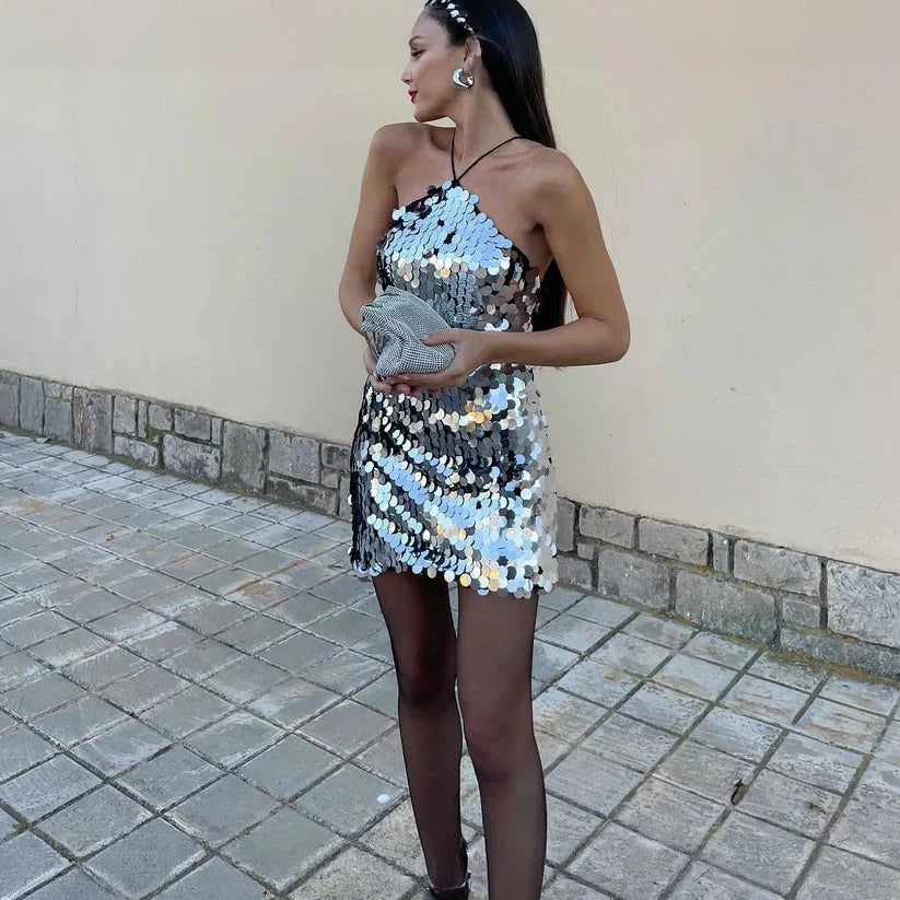 Sparkling miniature glamour dress with sequins by Montaracrest, featuring a fitted silhouette and shimmering embellishments.