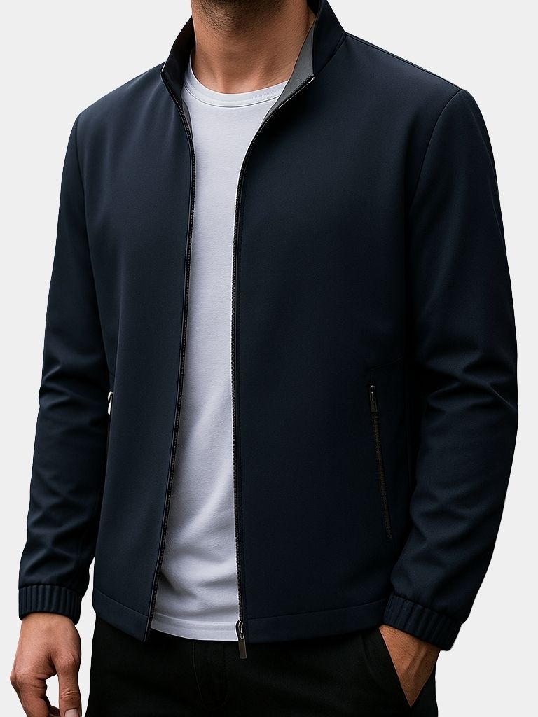 Montaracrest Giacca Lucien Zip, a stylish men's zip-up jacket in dark fabric with a high collar and front pockets.