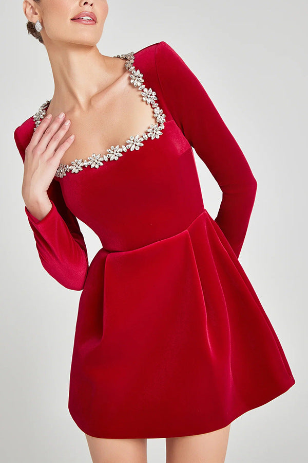 Montaracrest mini A-line dress with jewelry-inspired details, featuring elegant fabric and intricate embellishments.