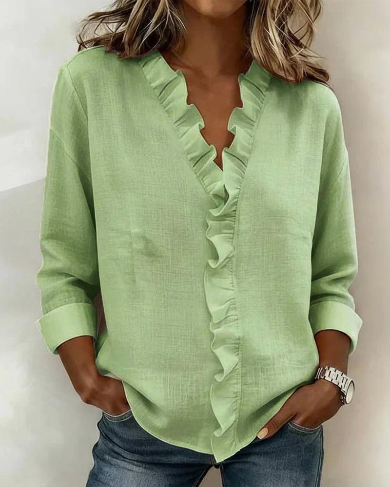Chiara™ Montaracrest V-neck blouse with delicate ruffle detailing, lightweight fabric, and feminine style.