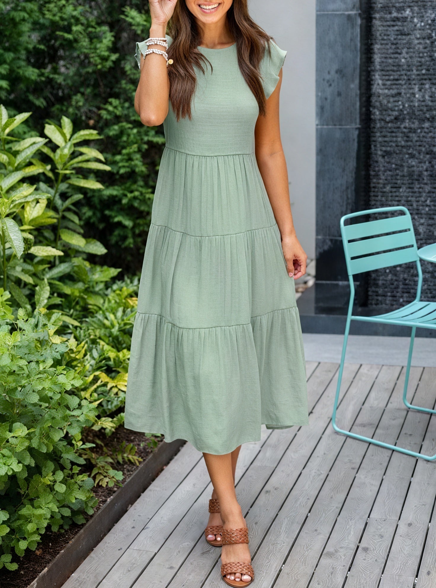 Fluid chiffon dress with ruffled sleeves and tiered skirt by Montaracrest, stylish and elegant for special occasions.