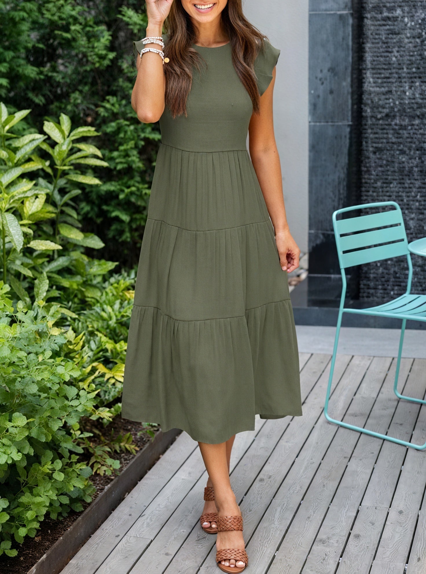 Fluid dress with ruffled accents and volant sleeves by Montaracrest, featuring a breezy, elegant silhouette.