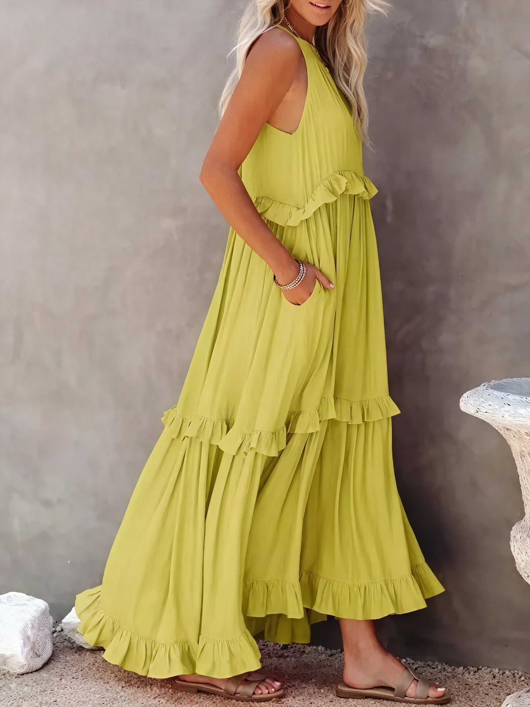 Montaracrest maxi fluid dress with American-style neckline and ruffle details, shown on a model.