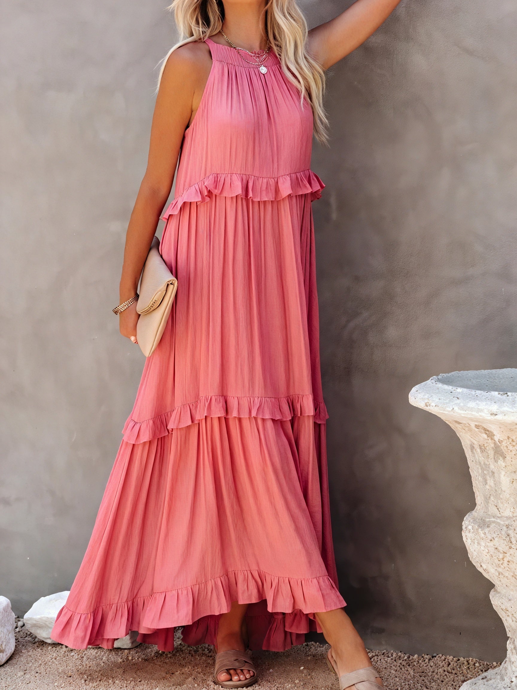 Long flowing maxi dress by Montaracrest featuring an American-style neckline and ruffle details on the sleeves.