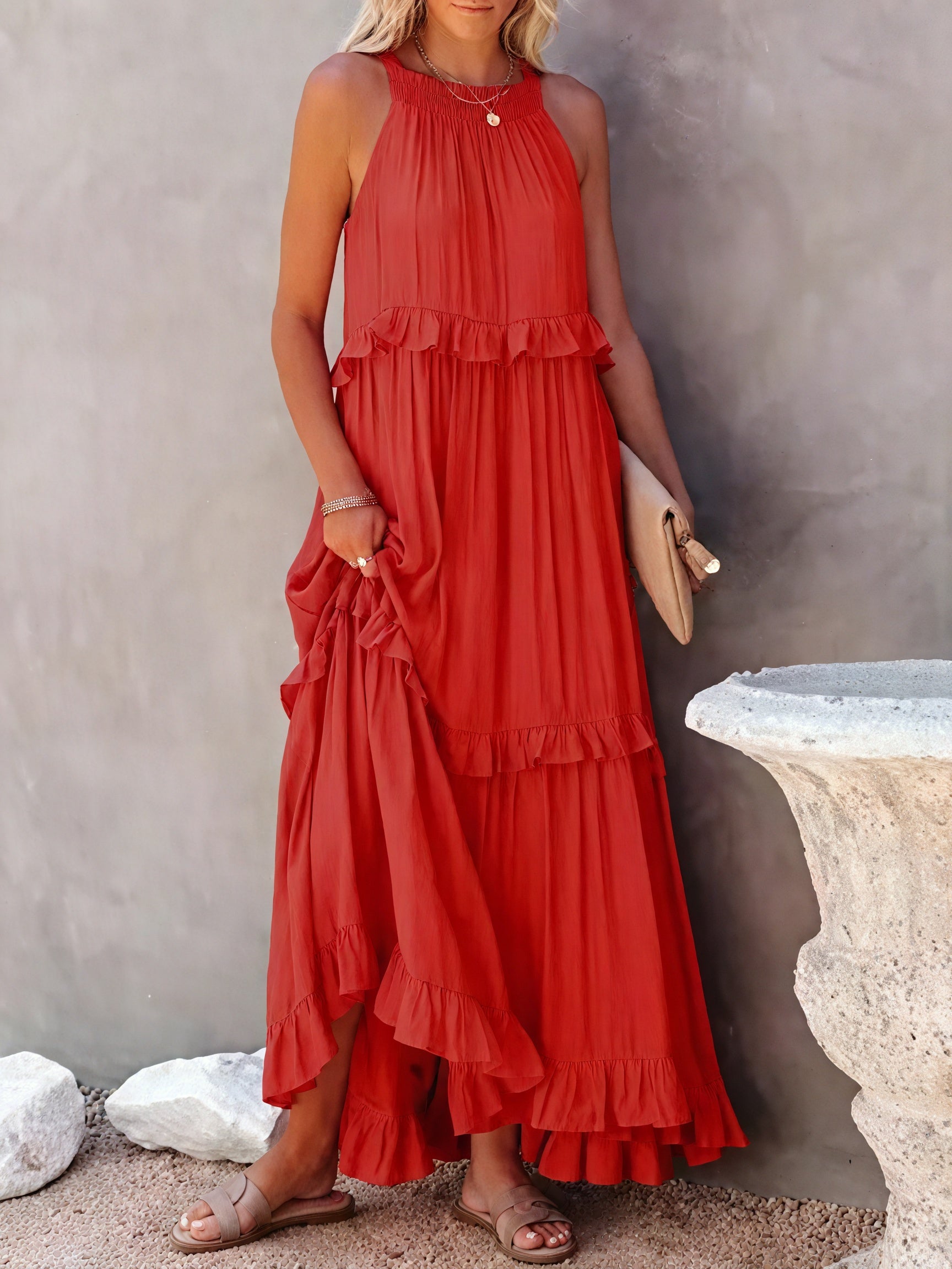 Fluid maxi dress by Montaracrest with American-style neckline and ruffle details, shown on a model in the image.