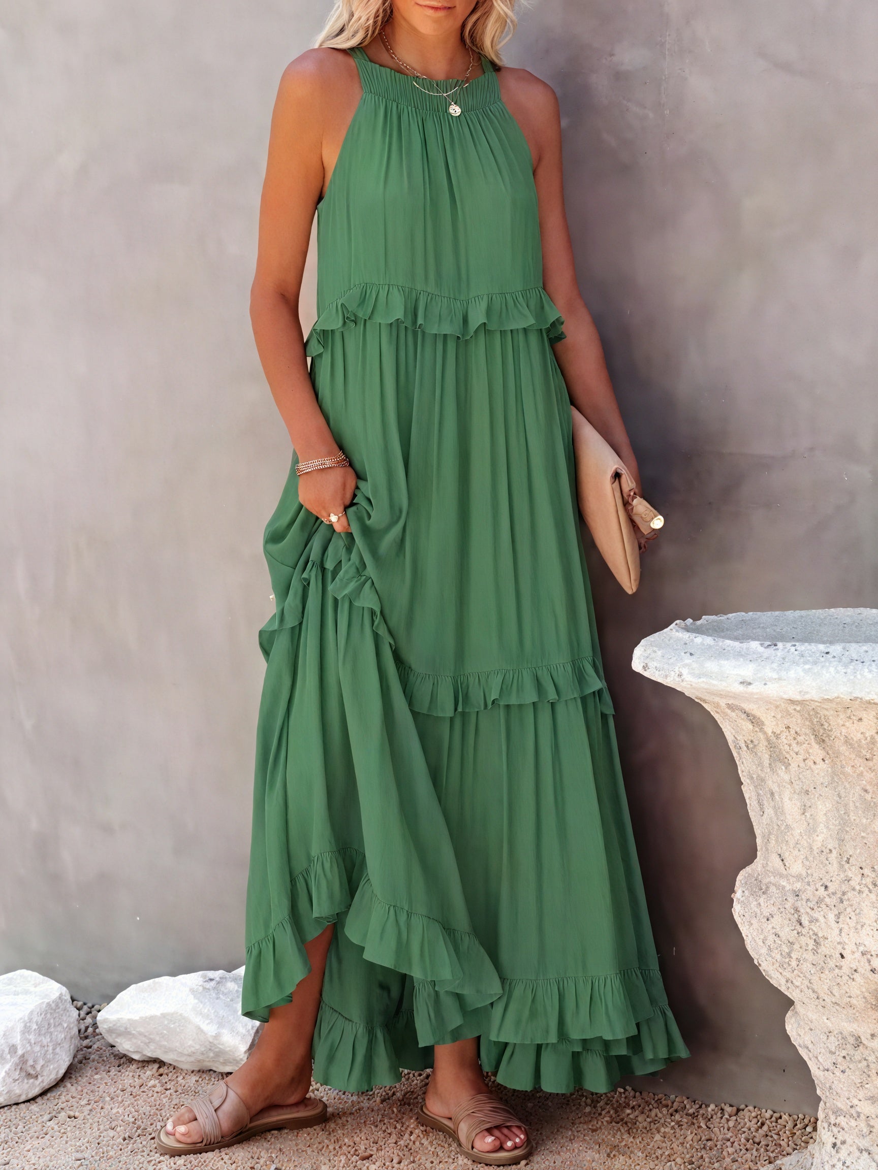 Fluid maxi dress with American-style neckline and ruffle details by Montaracrest, shown on a model.