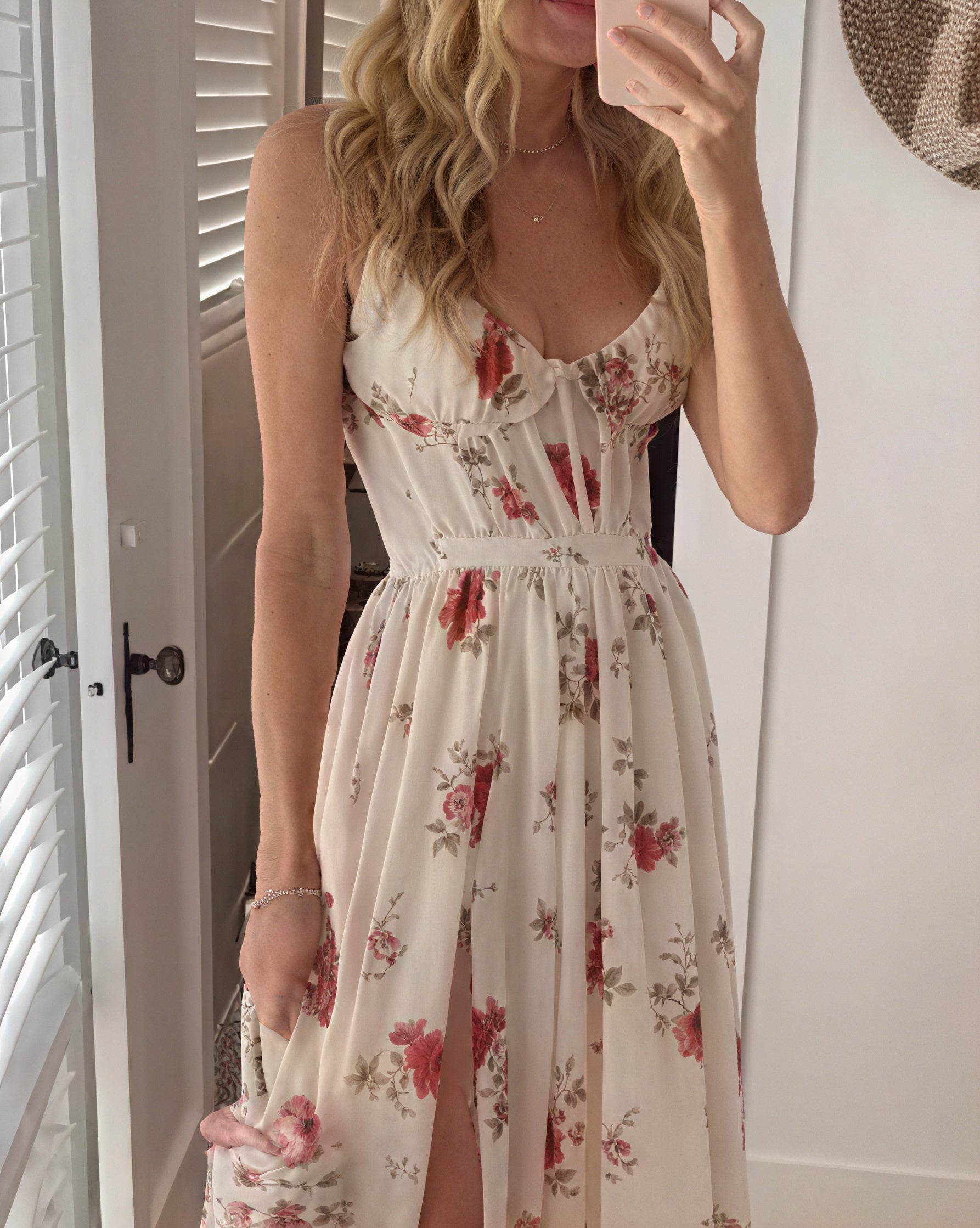 Elegant floral maxi dress with deep slit and thin straps by Montaracrest, showcased on a model.