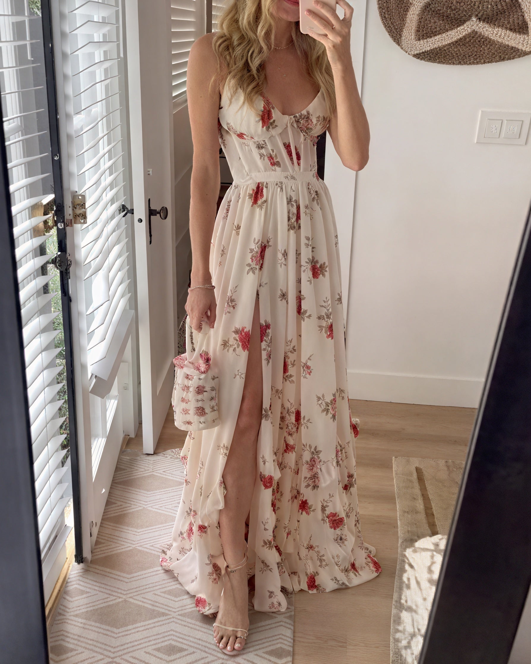 Montaracrest floral maxi dress with deep slit and thin straps, elegant summer evening wear, shown on a model.
