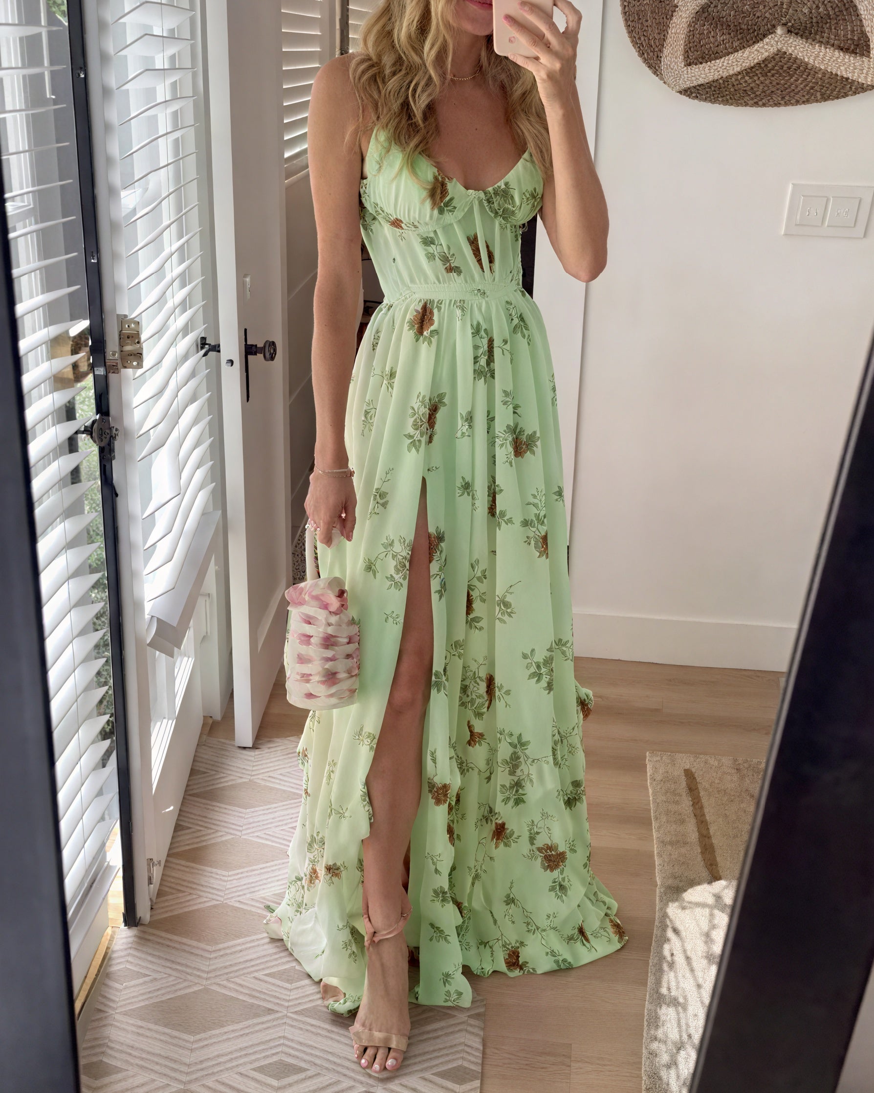 Montaracrest floral maxi dress with deep slit and thin straps, elegant evening wear showcased in a stylish image.