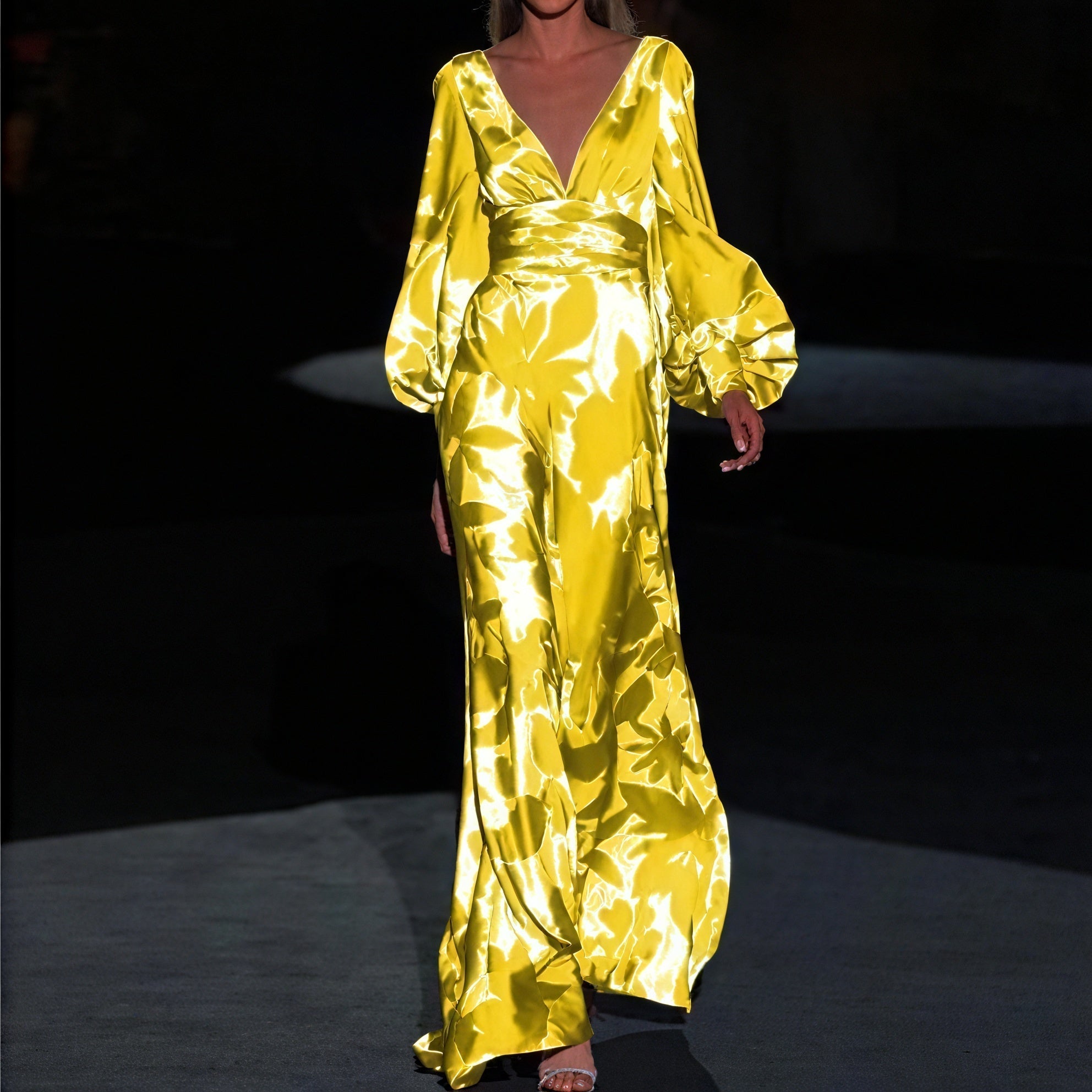 Elegant long dress by Montaracrest featuring a flowing silhouette and feminine design, perfect for formal occasions.