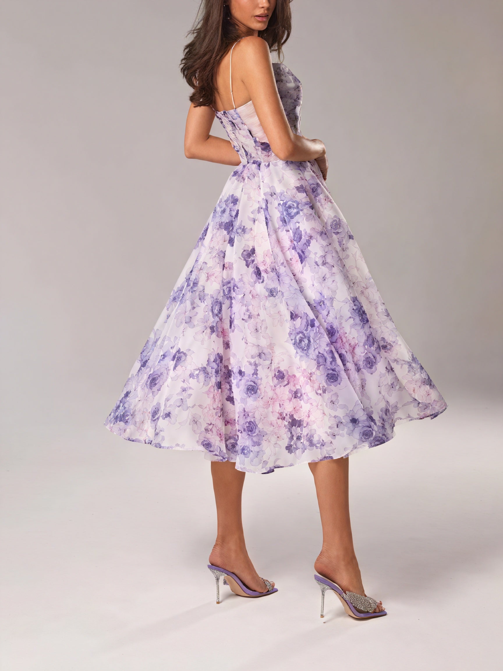 Floral midi dress by Montaracrest featuring a spring-inspired design, flowing fabric, and elegant silhouette.