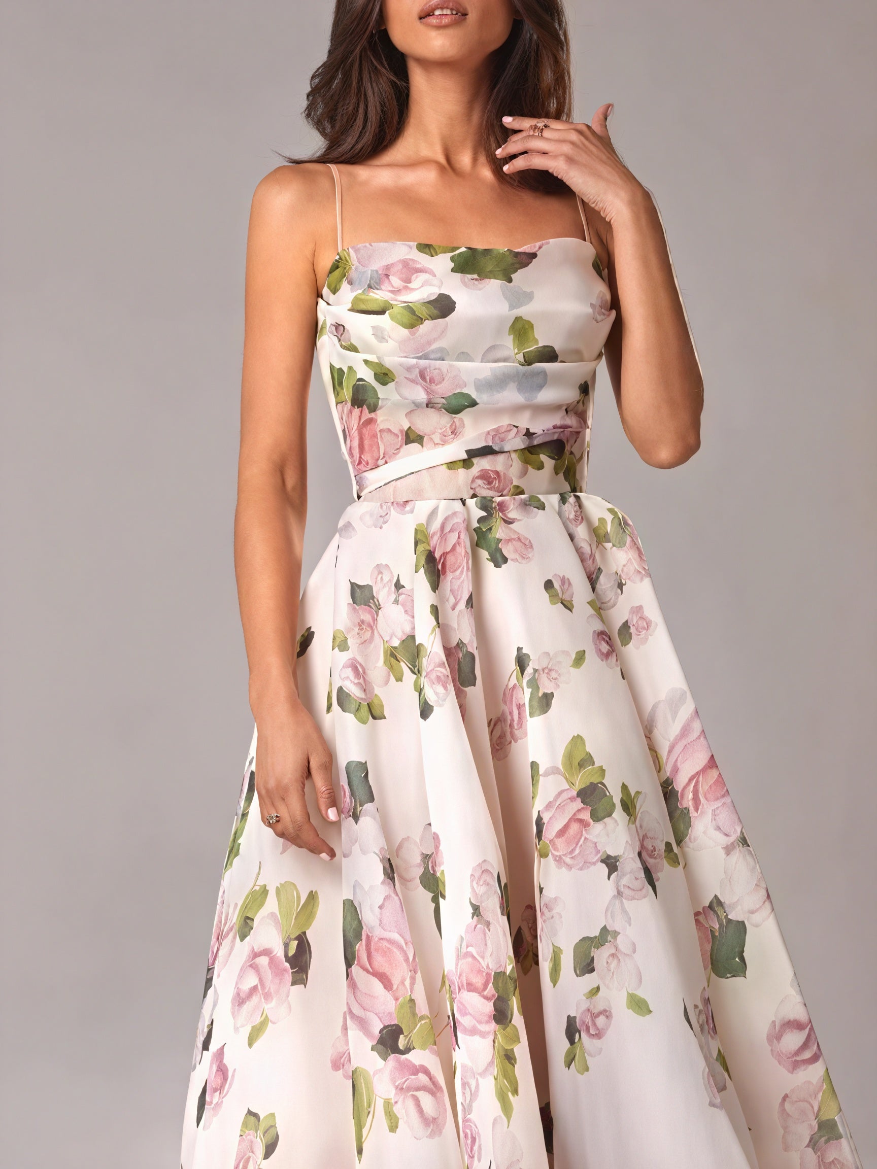 Floral midi dress by Montaracrest featuring a vibrant spring-inspired pattern and elegant silhouette.