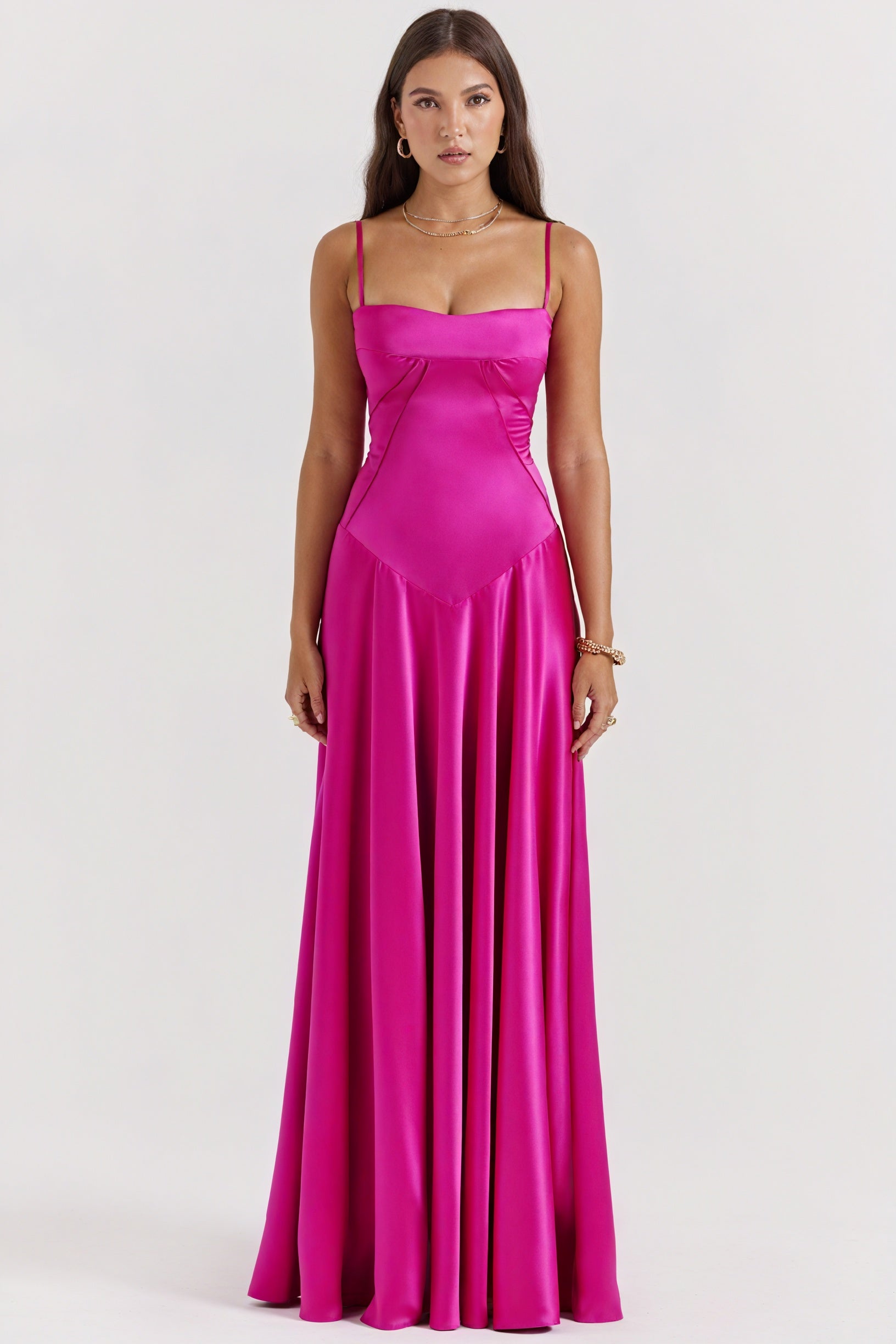 Elegant long dress by Montaracrest featuring a flowing silhouette, perfect for special occasions and formal events.