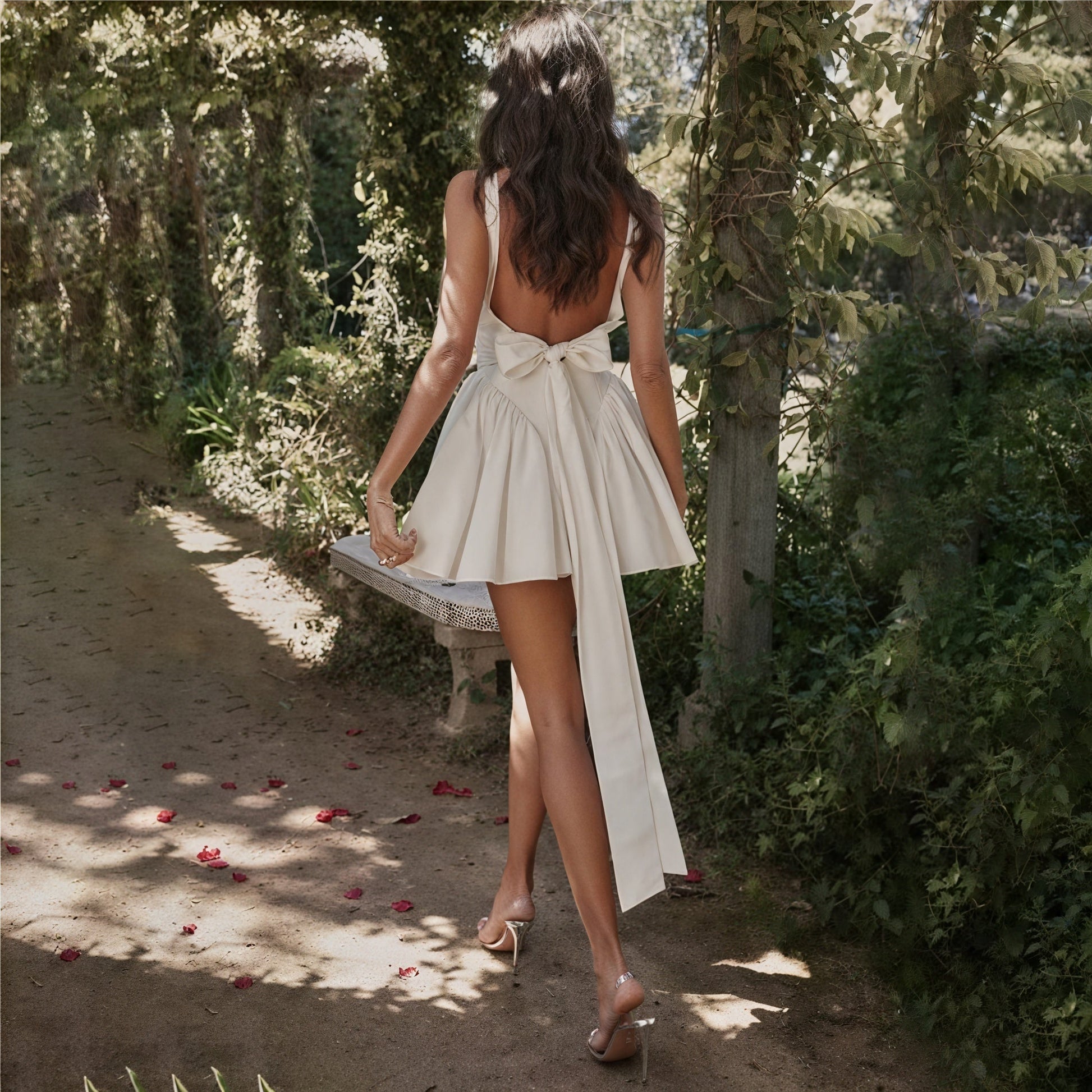 White A-line dress by Montaracrest with square neckline and sleeveless design, perfect for elegant summer occasions.