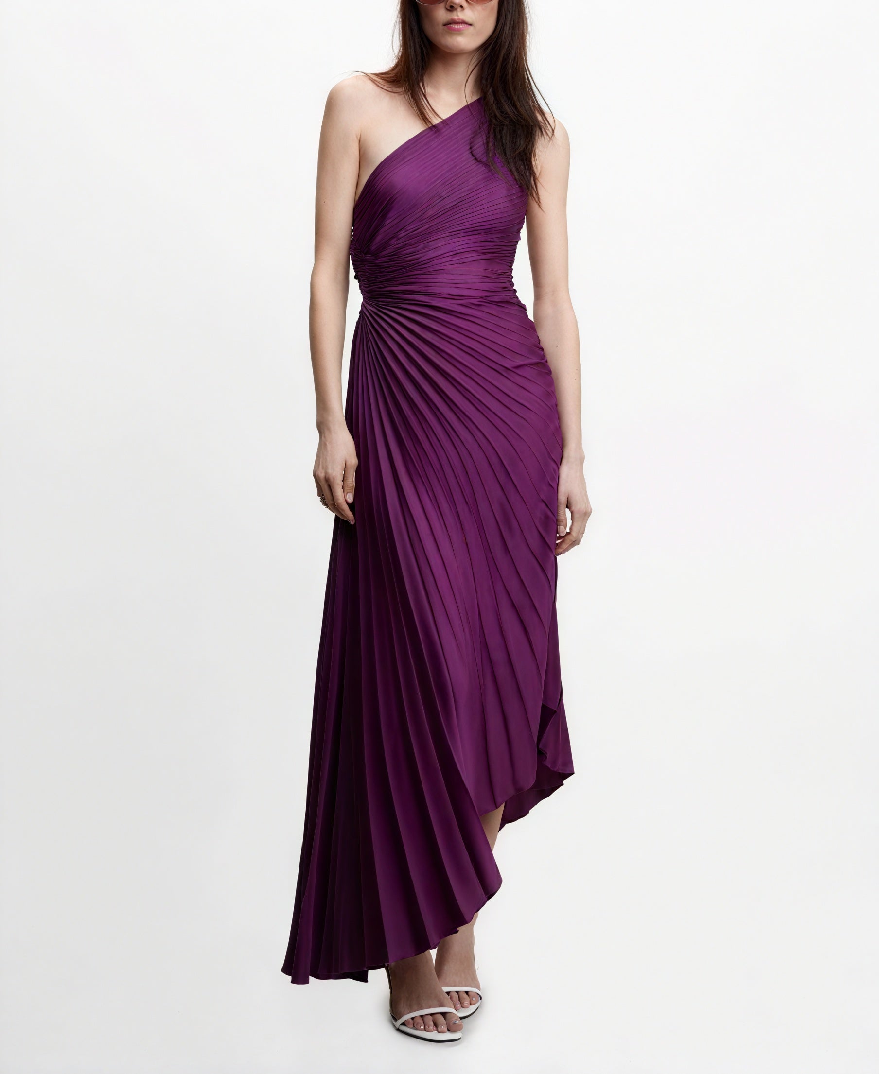 Cream monospalla plissé dress with asymmetrical hem by Montaracrest, featuring elegant draping and delicate pleats.
