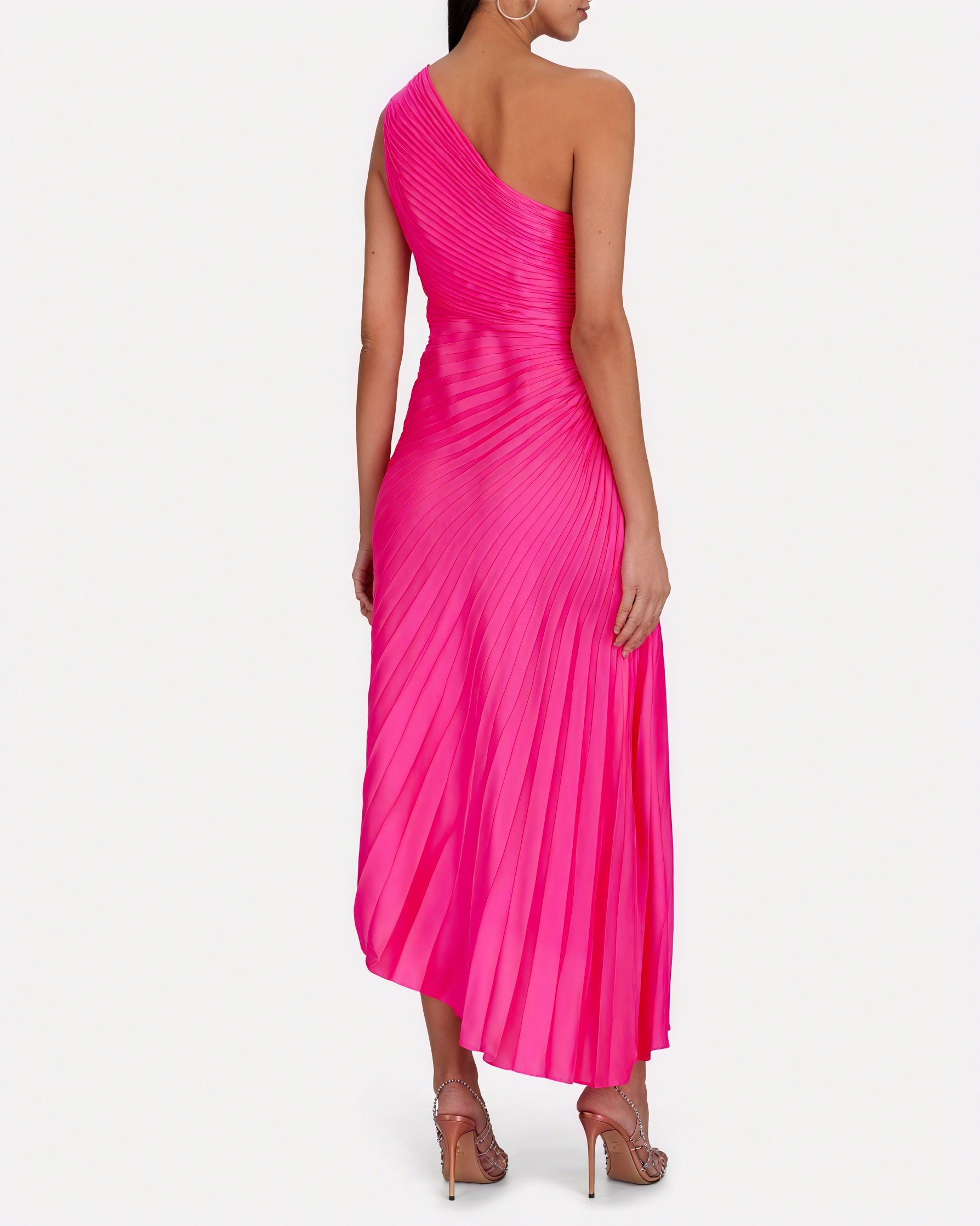 Montaracrest monospalla plissettato dress with asymmetrical hem, featuring a one-shoulder design and elegant pleats.