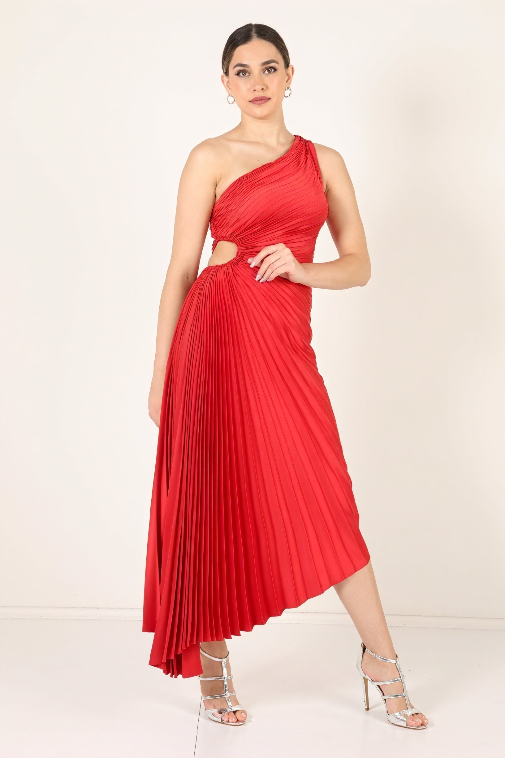 Maroon one-shoulder pleated dress with asymmetric hem from Montaracrest, showcasing elegant fabric and stylish design.
