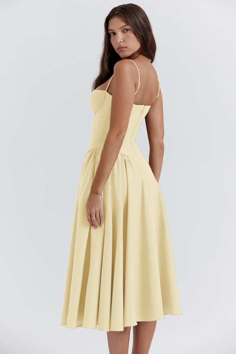 Montaracrest midi pleated dress with structured bust, side pockets, and elegant design, perfect for stylish occasions.