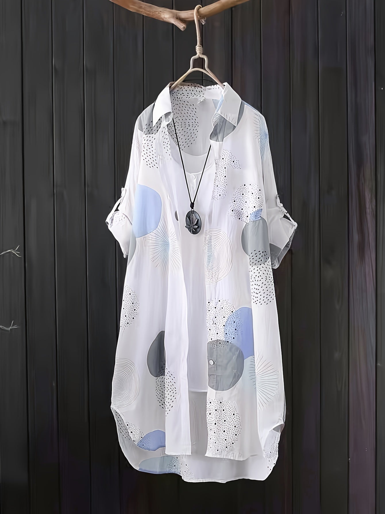 Light summer dress "Chiara" by Ravelli Milano featuring floral print and sleeveless design, perfect for warm weather.