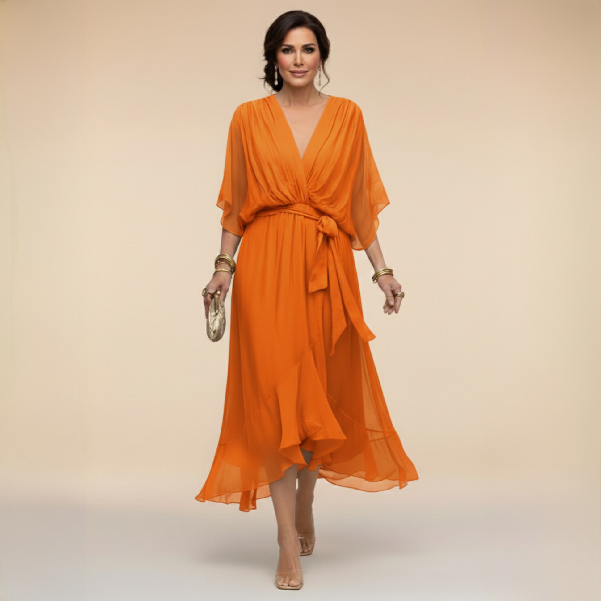 Montaracrest Monica chiffon dress with a V-neckline, flowing fabric, and an elegant sleeveless design, displayed on a hanger.