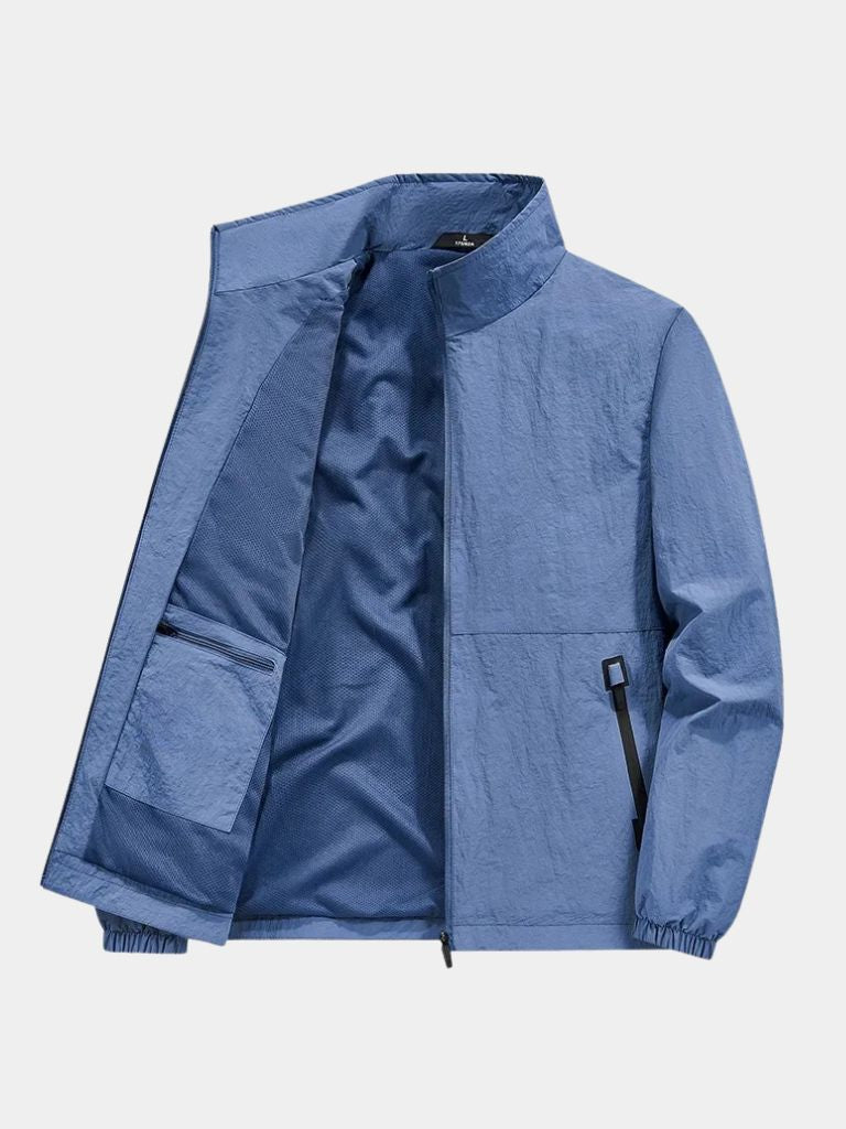 Montaracrest utility zip-up jacket, modern design with multiple pockets, lightweight fabric, in a neutral color.