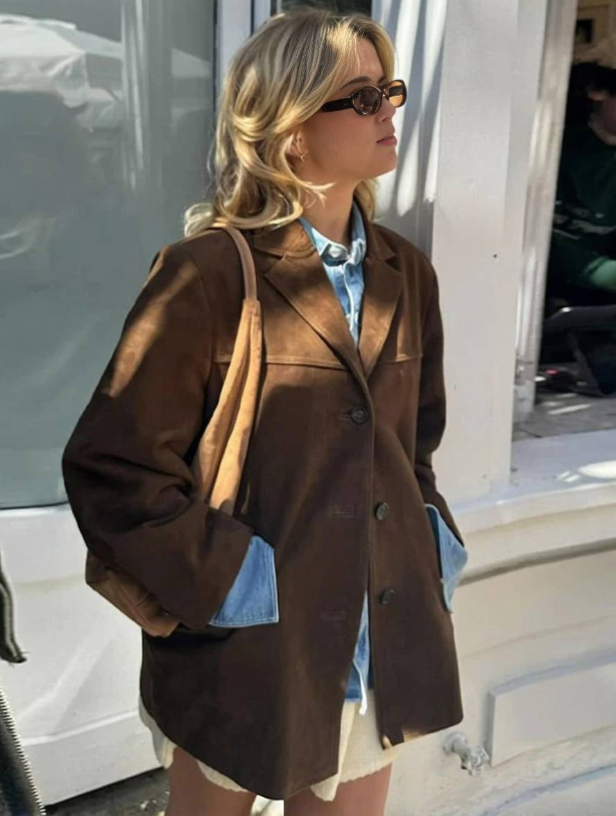 Montaracrest FIORA camoscio blazer jacket displayed on a hanger, showcasing the tailored design and soft suede fabric.