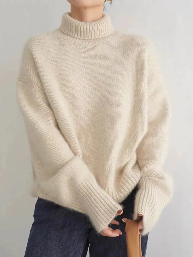 Montaracrest Isabella cashmere sweater for women, cozy beige knit with high collar, perfect for fall and winter wear.