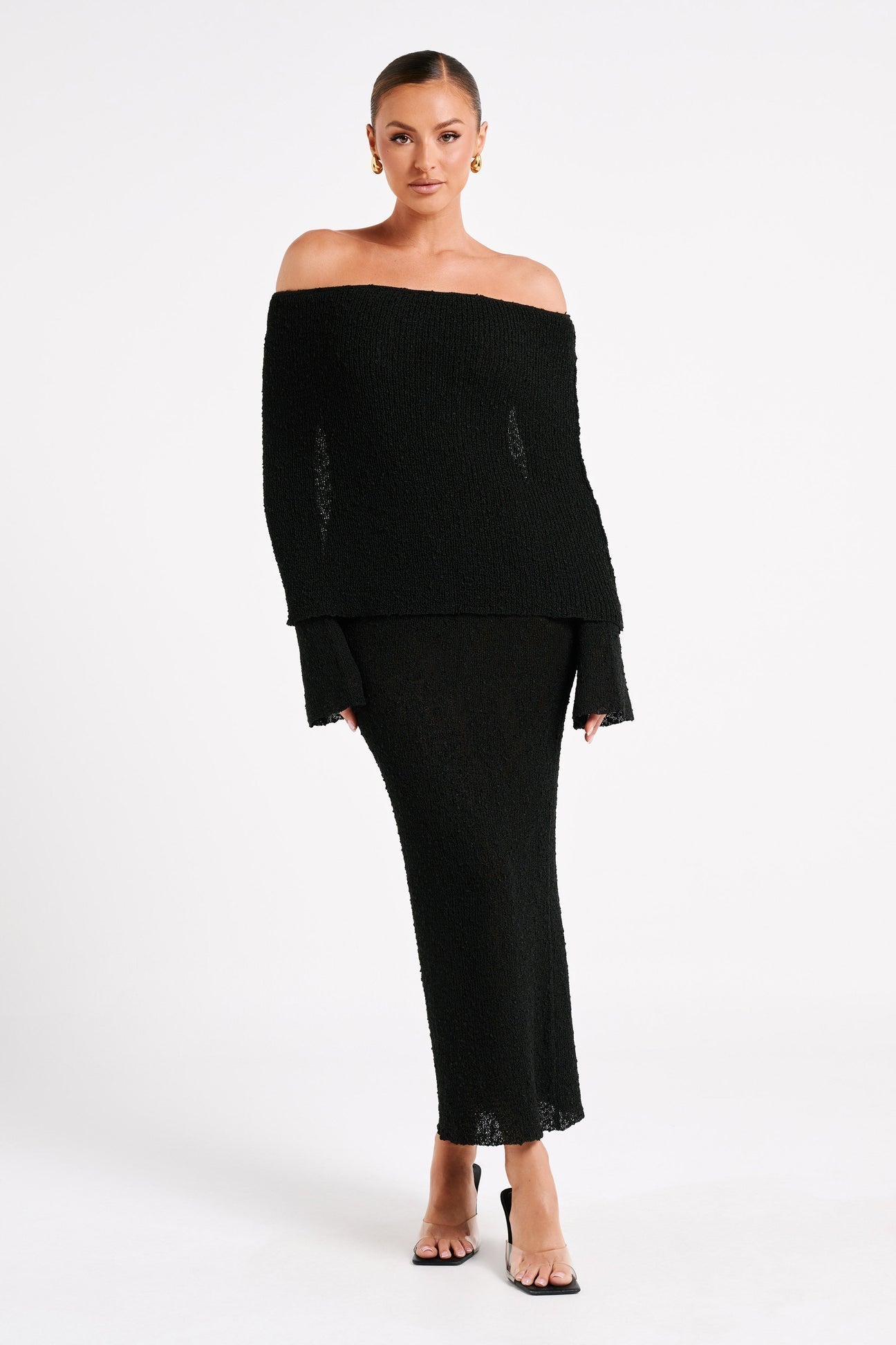 Elegant ivory drape gown by Montaracrest featuring flowing fabric and a sophisticated design, displayed on a mannequin.