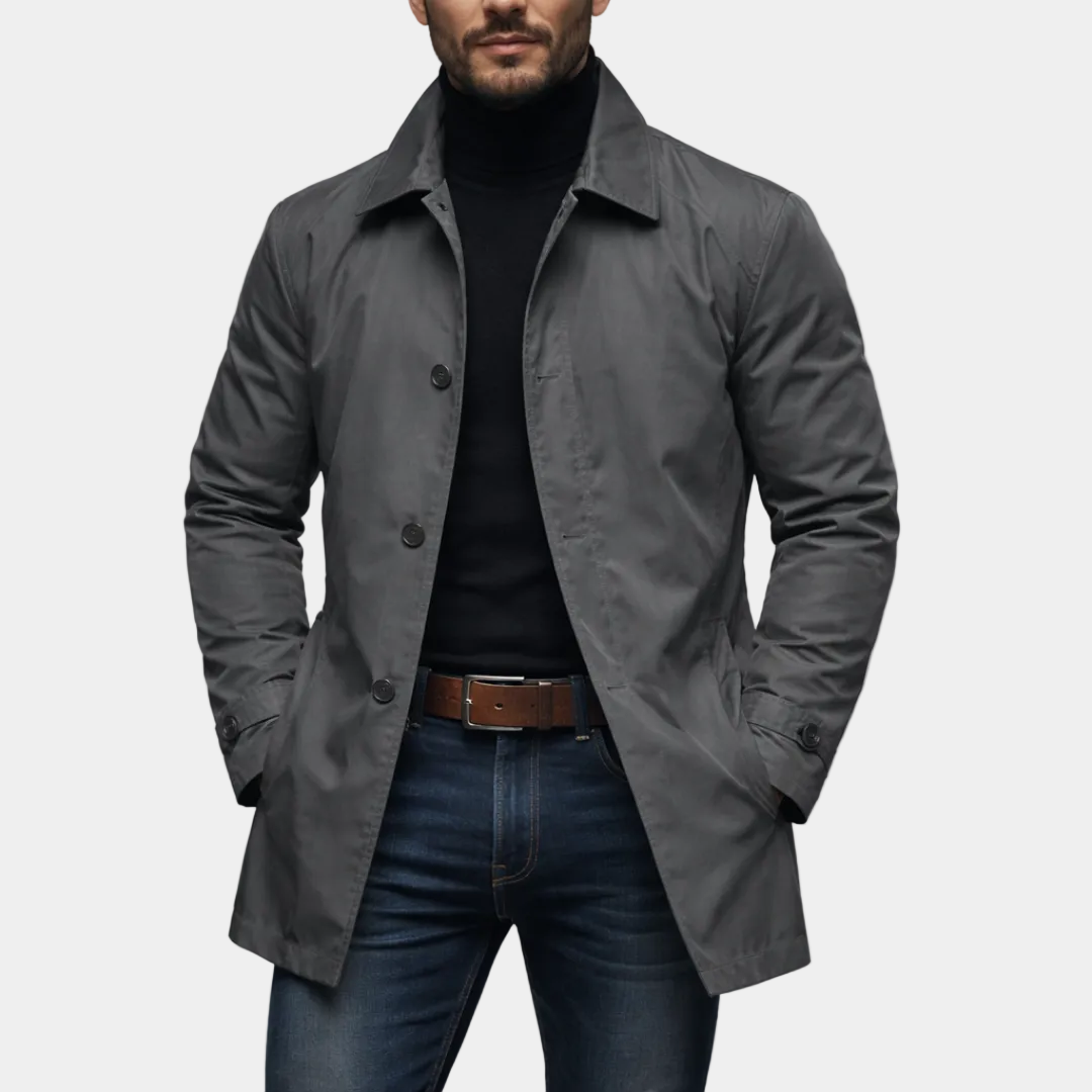 Alessandro Hareth waterproof coat in black with a hood, shown on a model, featuring sleek design and durable fabric.