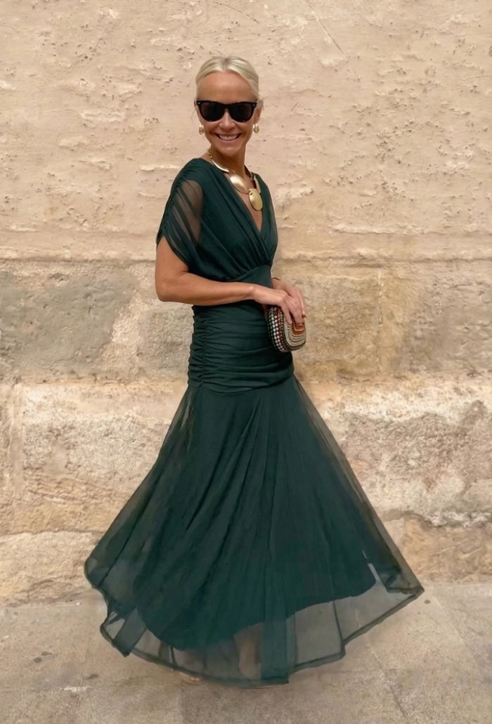 Elegant Montaracrest Luisa long dress with V-neckline, fitted silhouette, and flowing fabric, perfect for formal occasions