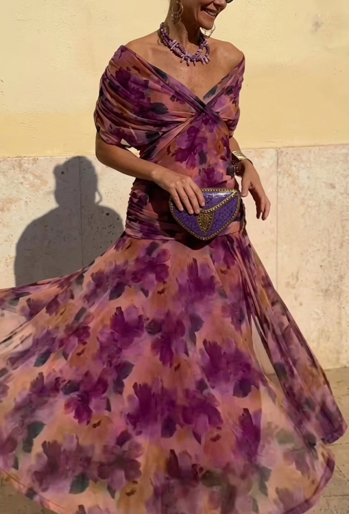 Elegant Montaracrest Luisa long dress with V-neckline and fitted silhouette, displayed in a stylish, flowing design.