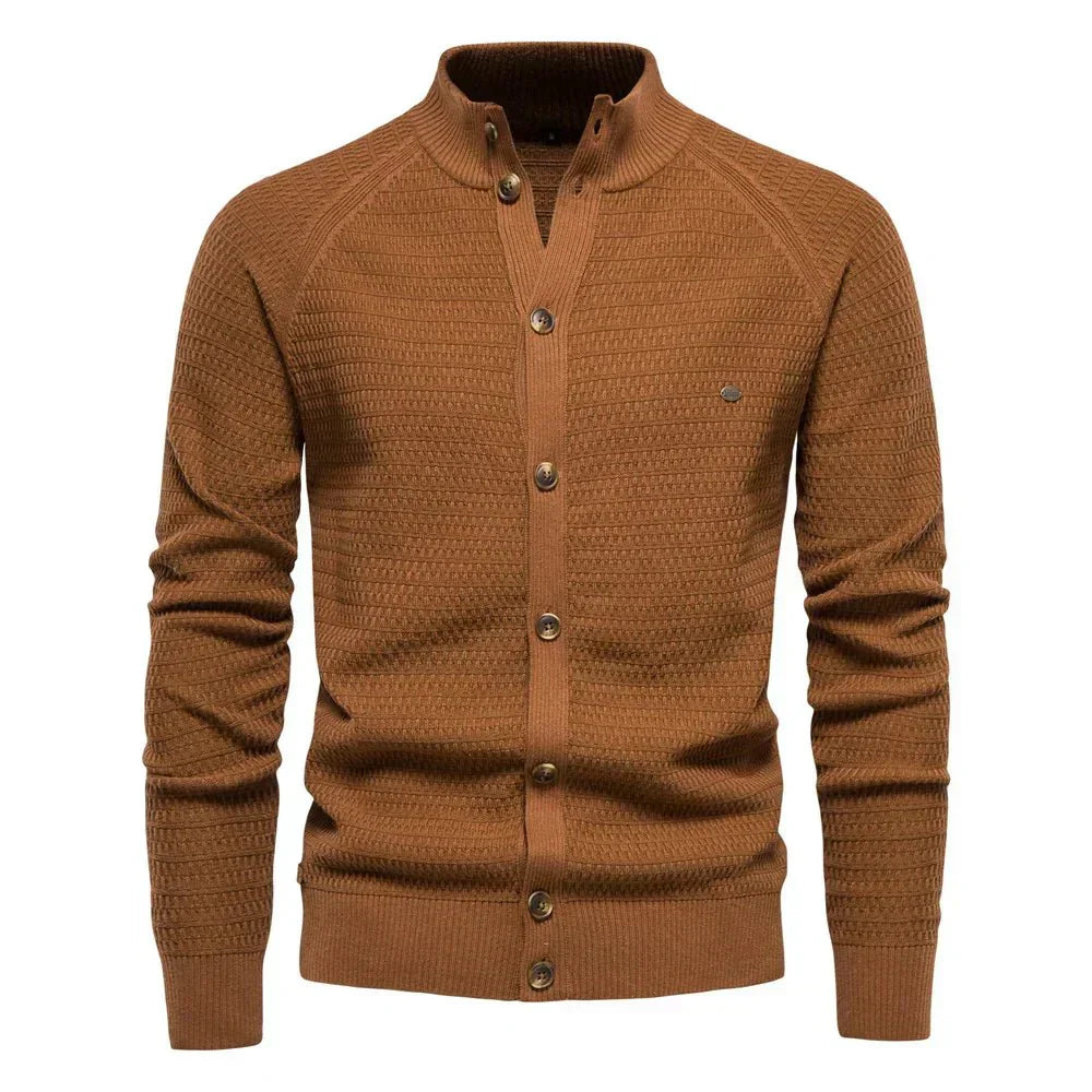Ottmar cotton cardigan by Montaracrest, featuring a soft knit fabric and classic design, worn by a model in a casual setting.