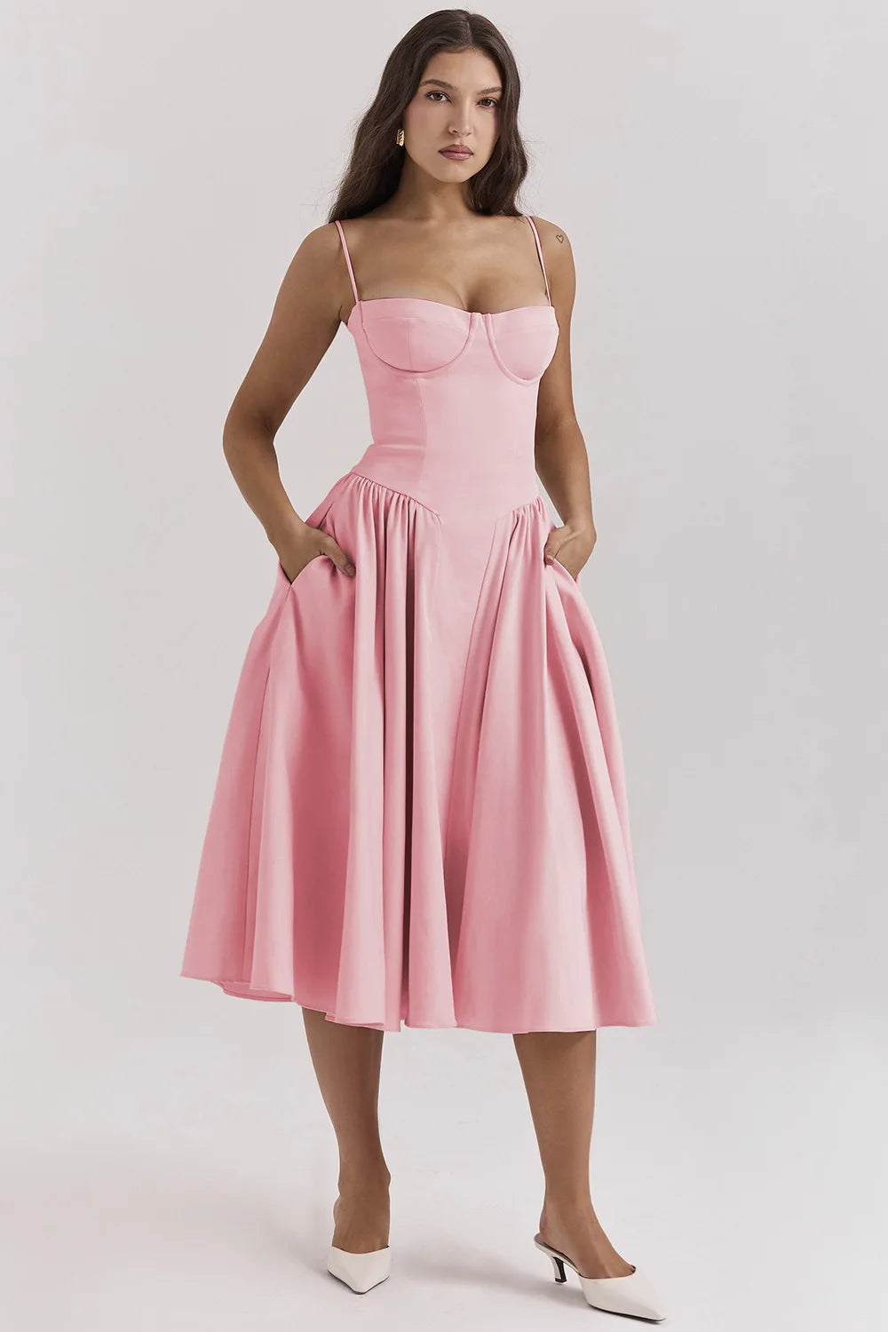 Montaracrest midi pleated dress featuring a structured bodice and practical pockets, elegant and stylish for various occasions.